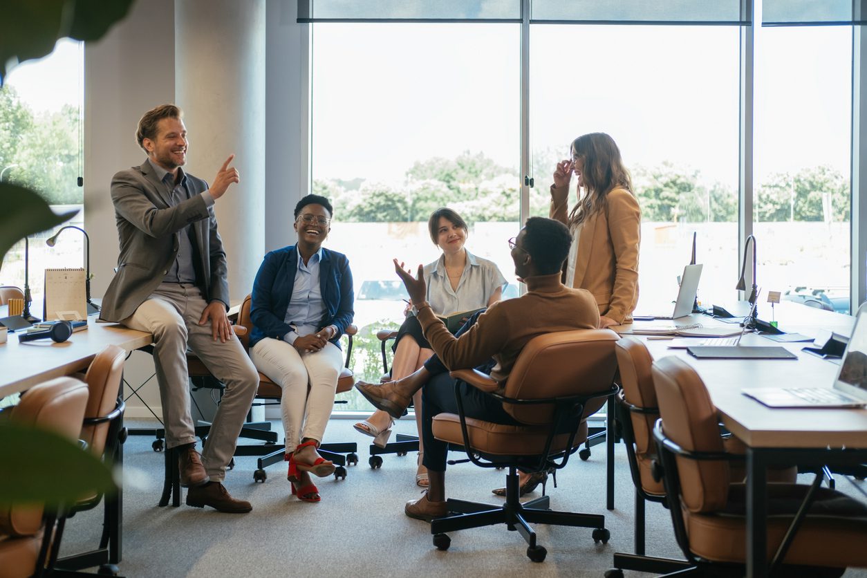 Group of Smiling Businesspeople in a Casual Meeting at their Company cultural alignment